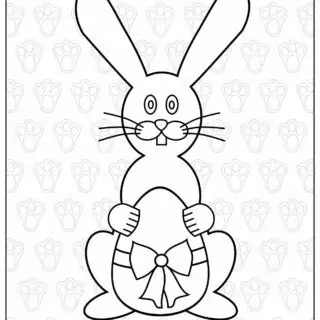 Easter bunny holds an egg