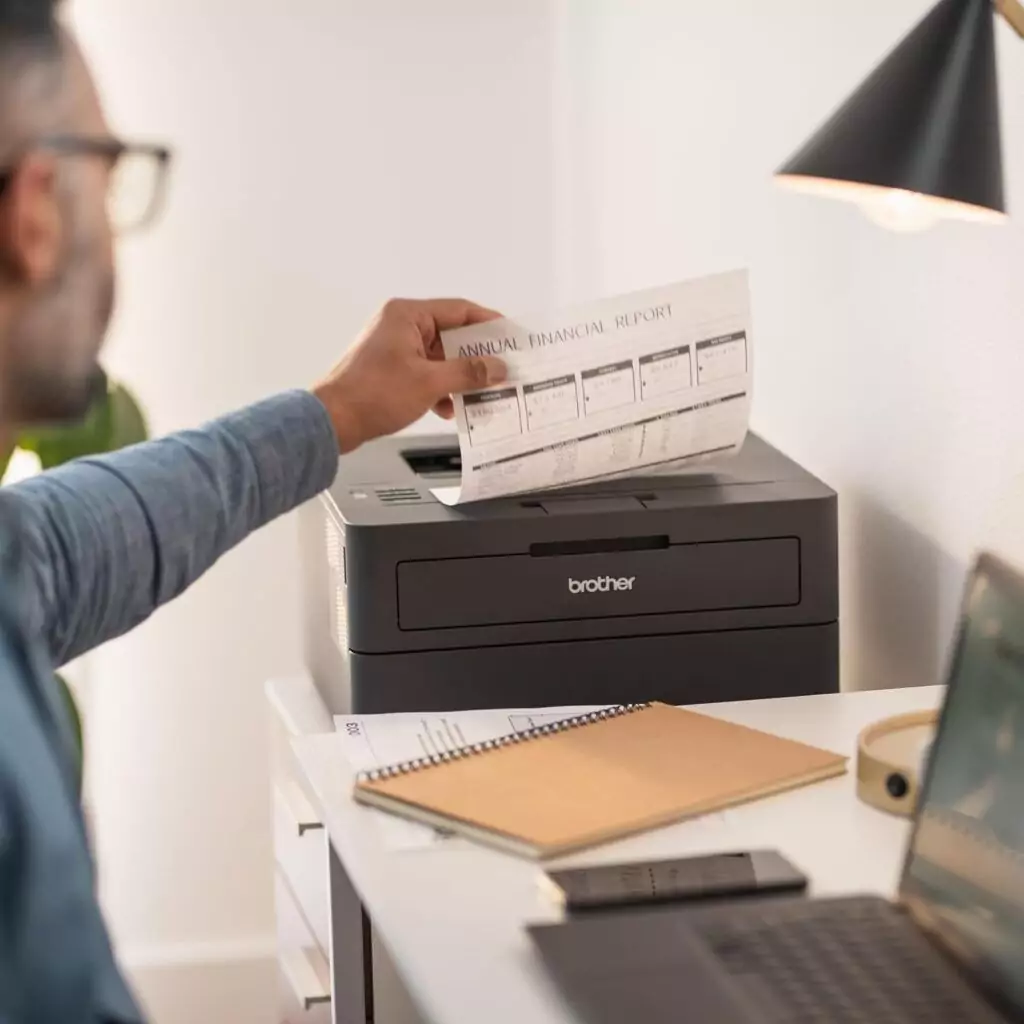 Brother HL-L2405W Wireless Monochrome Laser Printer in a classroom setting, perfect for educators seeking efficient mobile printing solutions.