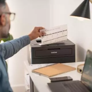 Brother HL-L2405W Wireless Monochrome Laser Printer in a classroom setting, perfect for educators seeking efficient mobile printing solutions.