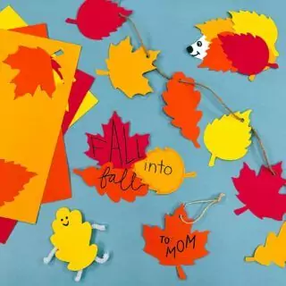 Fall Leaf Cutouts: Enhance classroom decor with double-sided cardstock featuring maple and oak designs, perfect for seasonal decoration.