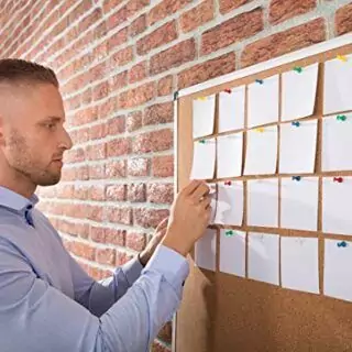 Wall-mounted silver aluminum cork board designed for educators. Ideal for classroom use; enhances organization and displays important notices efficiently.