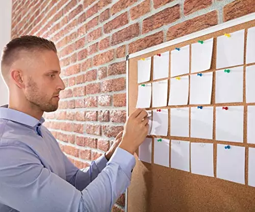 Wall-mounted silver aluminum cork board designed for educators. Ideal for classroom use; enhances organization and displays important notices efficiently.