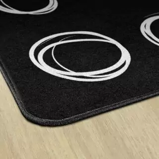 Vibrant circular sampler rug enhancing kids' educational spaces, fosters creativity and learning, perfect for stimulating classroom design.