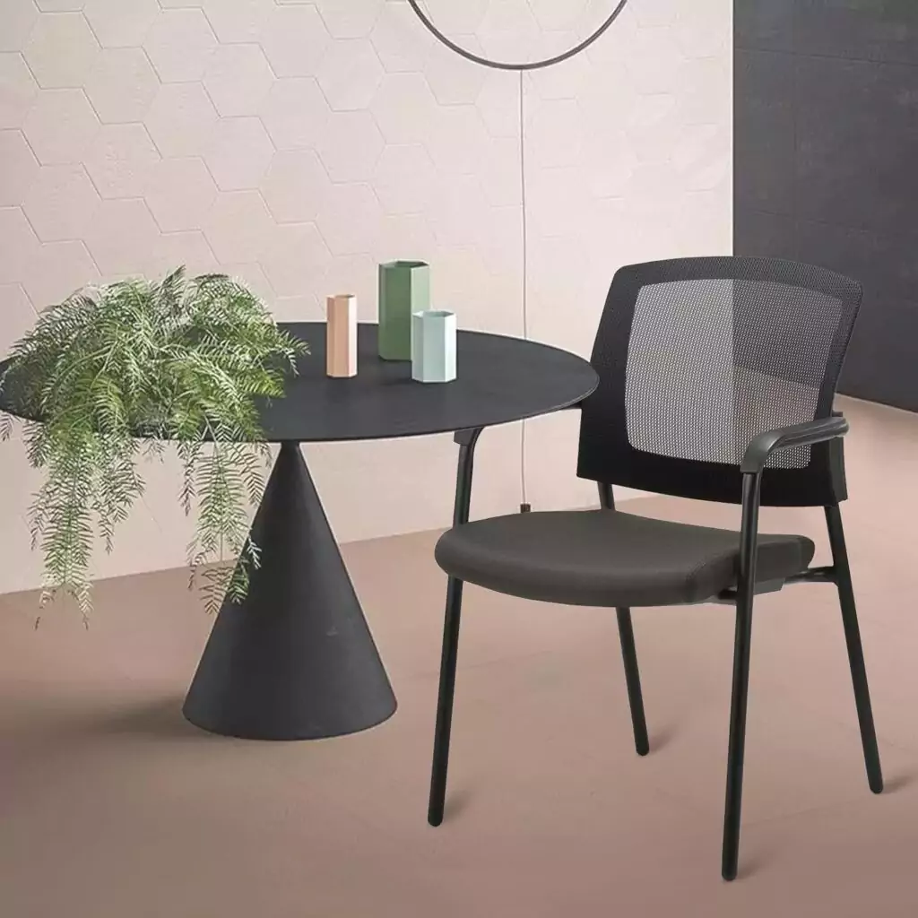 Ergonomic mesh back guest chair offers modern stackable design and lumbar support, perfect for educator comfort in classroom settings.