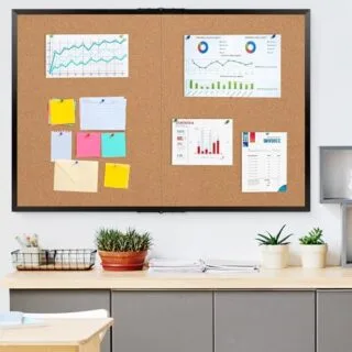 Foldable black frame cork board, ideal for classroom and office use, enhances display options with its spacious, versatile design.