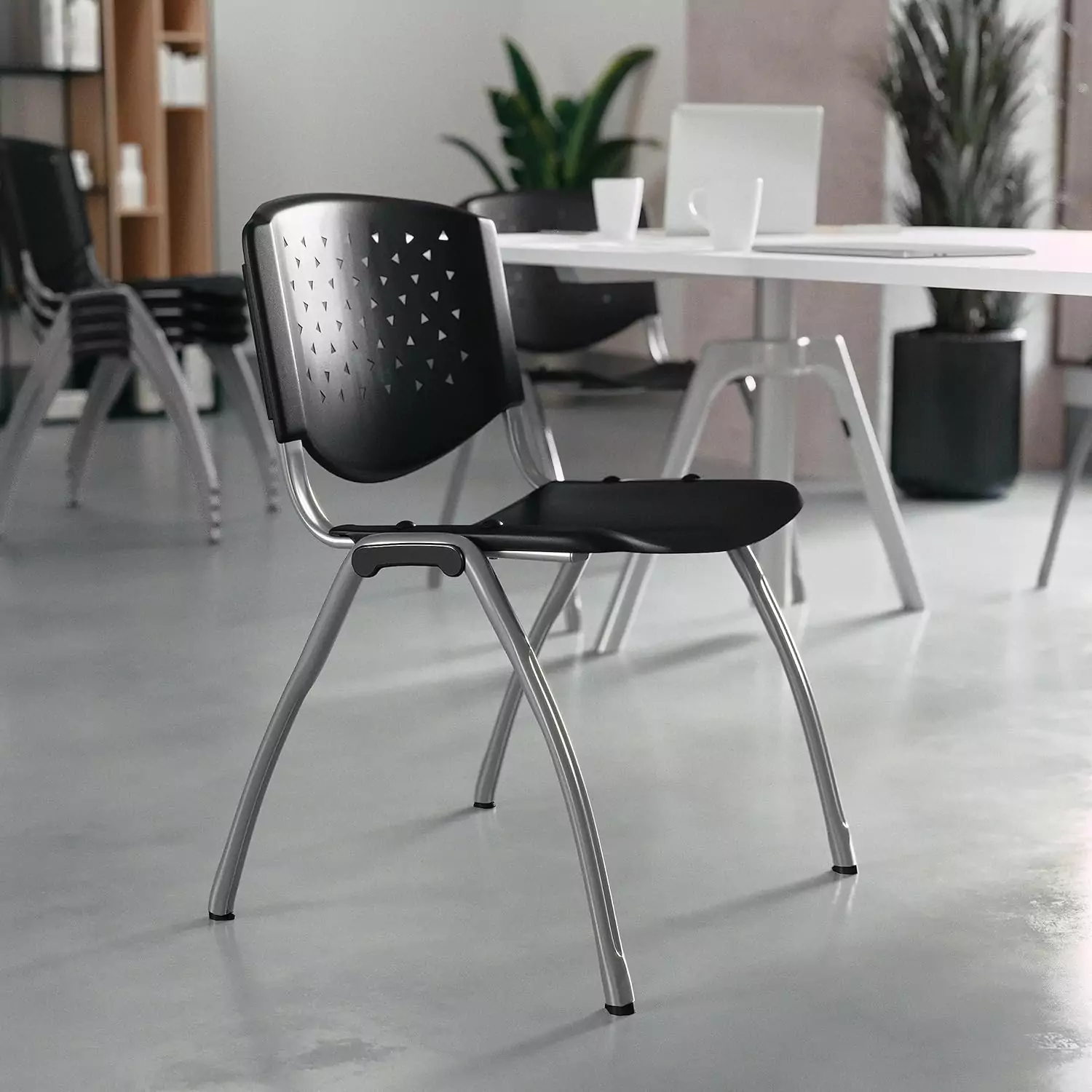 Ergonomic classroom chairs feature contoured seats and perforated backs, enhancing comfort and support for an ideal educational environment.