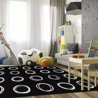 Vibrant educational circle rug designed for kids' classrooms and playrooms, enhancing learning with engaging colors and patterns.