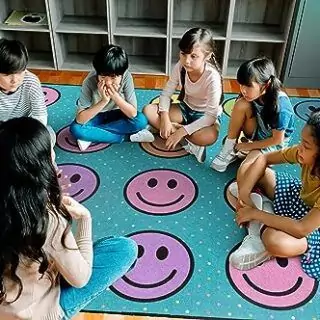 Colorful Flagship Carpets Smiley Seating Rug for Kids, perfect for creating an engaging and educational classroom environment.