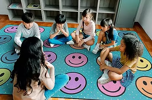 Colorful Flagship Carpets Smiley Seating Rug for Kids, perfect for creating an engaging and educational classroom environment.