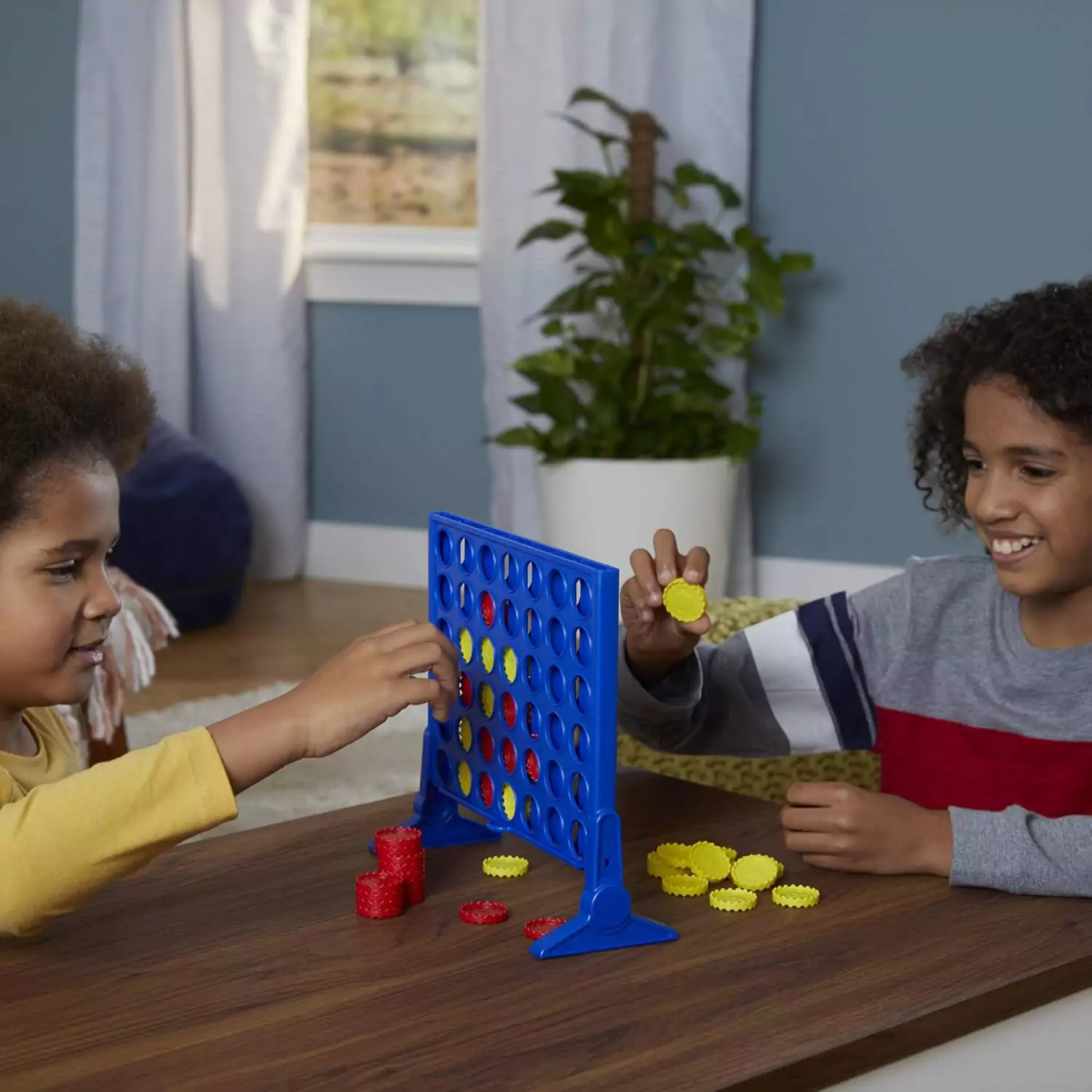 Hasbro Gaming Connect 4 is a classic strategy board game for kids, fostering educational fun and skill development with engaging gameplay.
