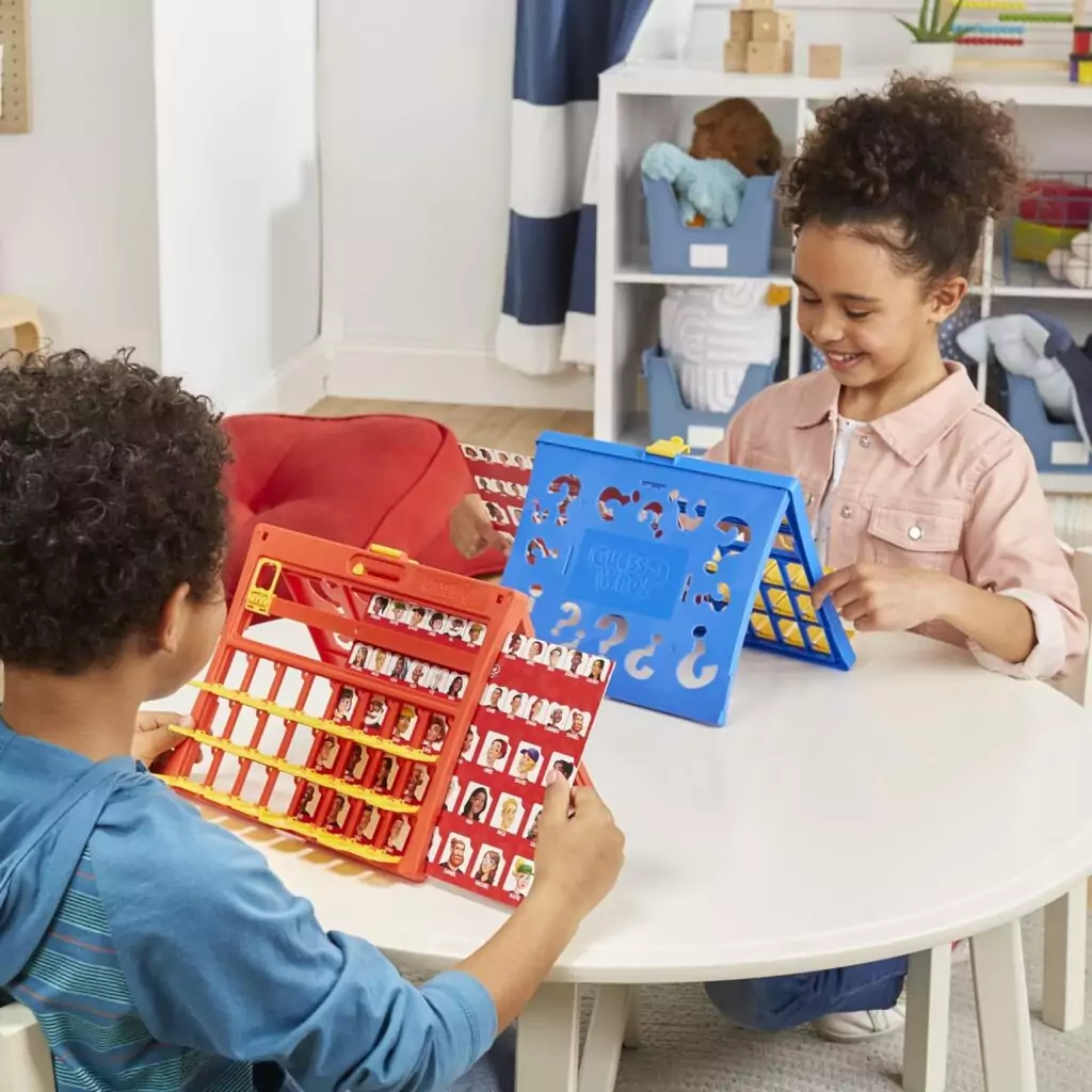 Hasbro Gaming Guess Who: A fun, educational game for kids featuring a double-sided board designed for two players to enjoy and learn.