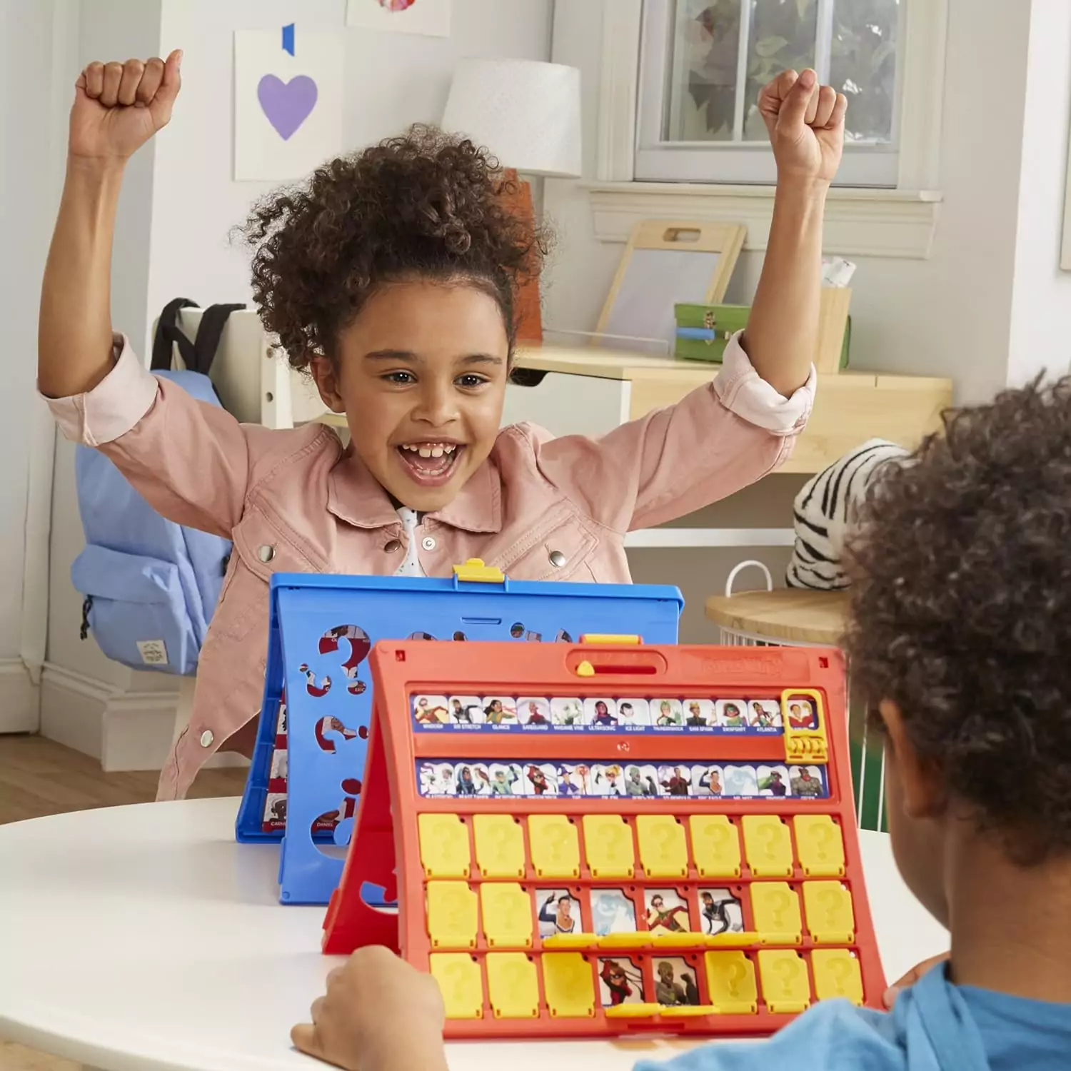 Guess Who Original Kids Game by Hasbro Gaming with double-sided boards offers fun and interactive learning. Perfect for family game nights.