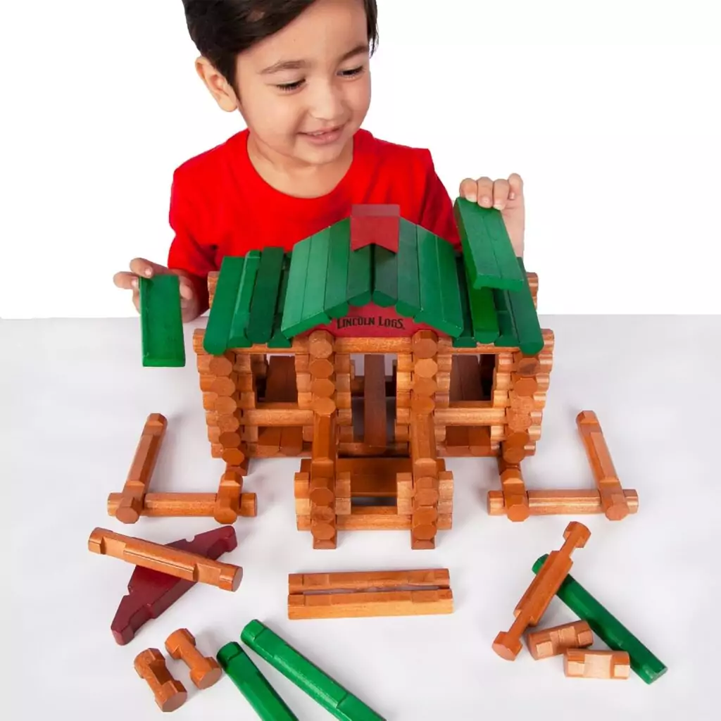 Lincoln Logs 100th Anniversary Tin includes 111 authentic wood pieces, perfect for preschool builders to boost creativity and construction skills.