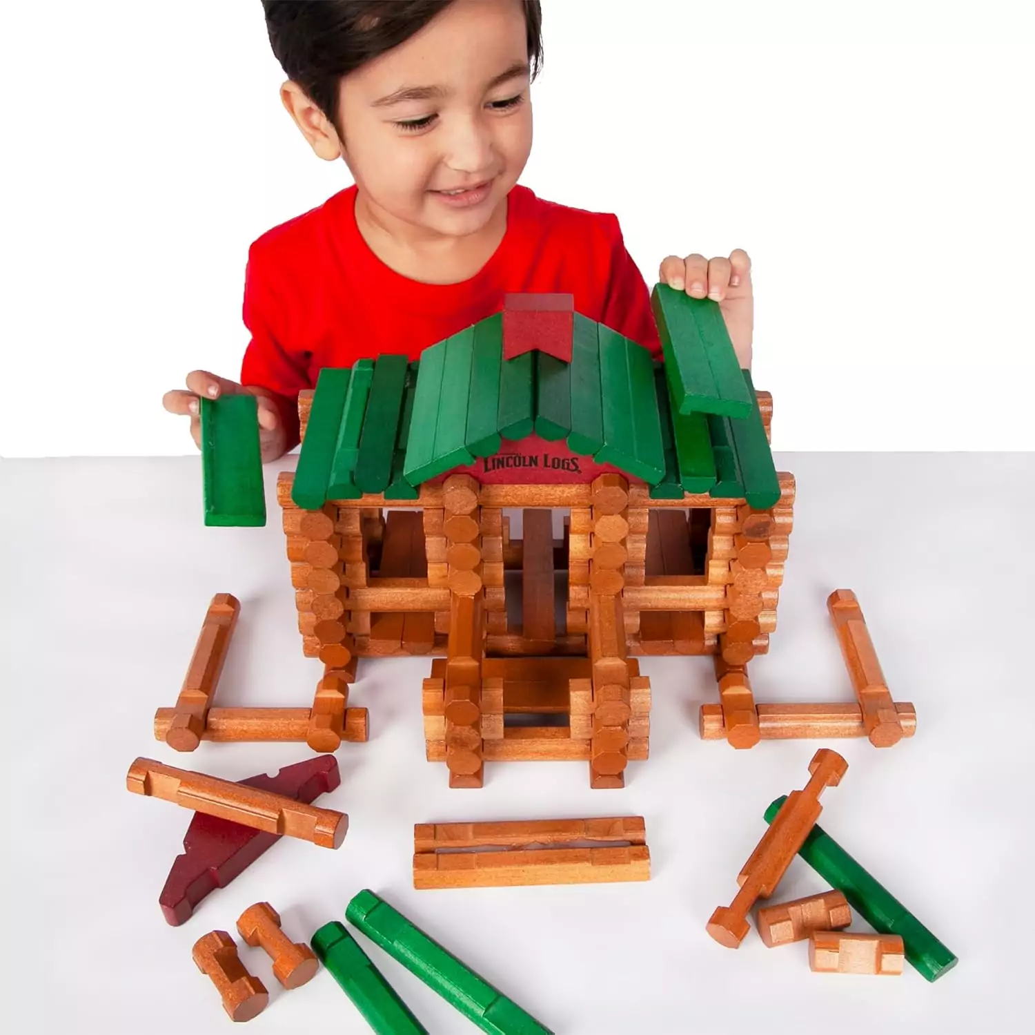 Lincoln Logs 100th Anniversary Tin includes 111 authentic wood pieces, perfect for preschool builders to boost creativity and construction skills.