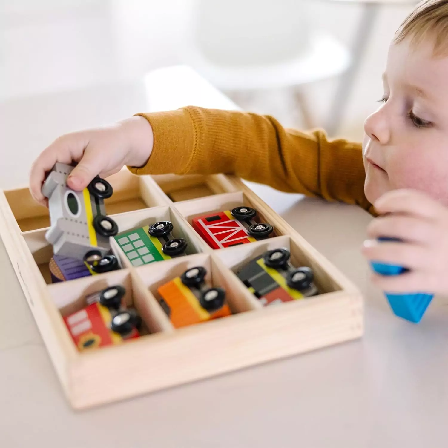 Melissa & Doug Wooden Magnetic Train Set: Engage kids with this interactive educational toy, perfect for developing essential skills through play.