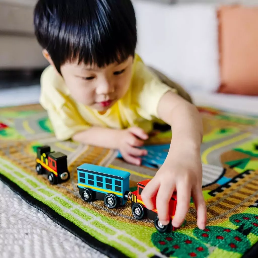 Melissa & Doug Wooden Magnetic Train Set: 8-piece educational toy designed for skill development and imaginative play in children.
