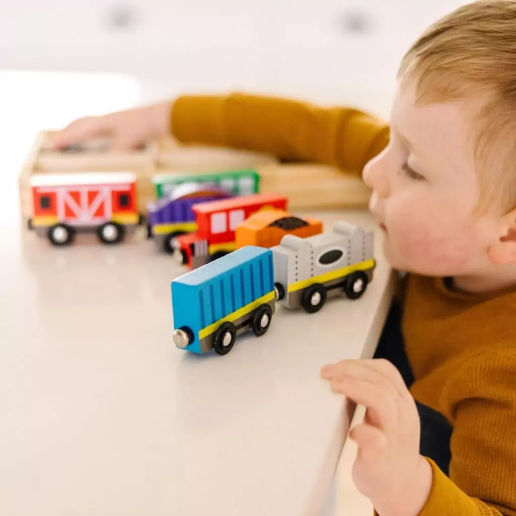 Melissa & Doug Wooden Magnetic Train Set, an educational toy designed to enhance skill development with vibrant and engaging play elements for children.