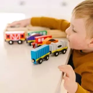 Melissa & Doug Wooden Magnetic Train Set, an educational toy designed to enhance skill development with vibrant and engaging play elements for children.