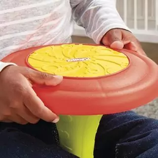 Playskool Sit 'n Spin toy aids toddler motor skill development and offers engaging activity for young children, enhancing coordination and balance.