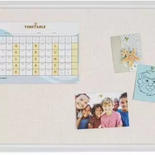 Rustic white-framed linen message board, perfect for classroom displays. Enhance your space with farmhouse style and functional organization.