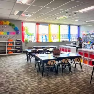 Colorful sheer rainbow curtains ideal for enhancing classroom and nursery backdrops, offering a lively and inviting atmosphere for young learners.