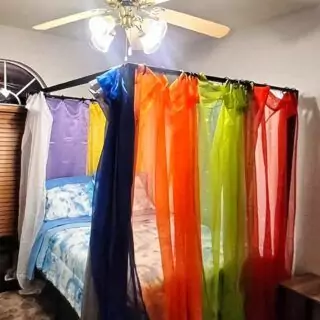Colorful transparent rainbow curtains perfect for enhancing playroom or nursery decor, providing a bright, playful backdrop for children's spaces.