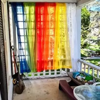 Bright and colorful rainbow curtains add a playful touch to a classroom, serving as an educational decor backdrop. Ideal for inspiring creativity and learning.