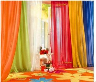 Colorful sheer rainbow curtains ideal for playrooms, nurseries, and classrooms, creating a vibrant atmosphere and playful backdrop.