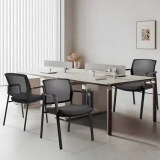 Ergonomic Clatina stacking chairs with mesh backs and upholstered seats provide durable design and lumbar support, perfect for classrooms.