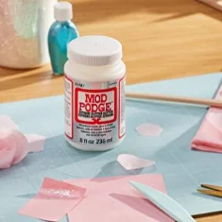 Enhance classroom creativity with 8oz Mod Podge Extreme Sparkle, offering a shimmering craft experience and a unique glitter finish. Perfect for DIY projects.