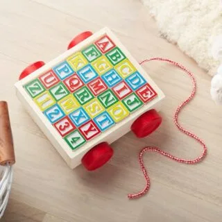 Enhance early learning with the Melissa Doug ABC Block Cart Toy, featuring 30 colorful wooden blocks for engaging and interactive playtime.