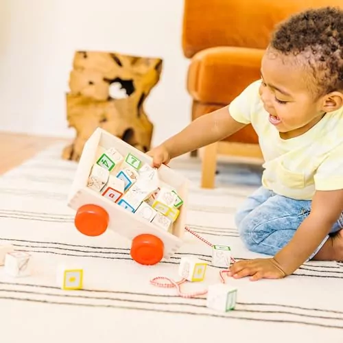 Enhance early learning with the Melissa & Doug Classic ABC Block Cart, featuring 30 solid wood blocks for fun and educational play.