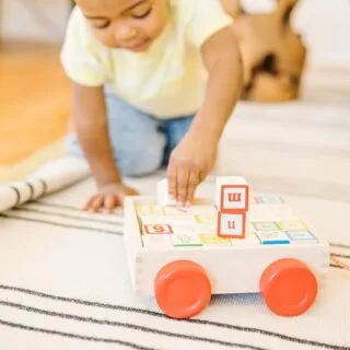 Colorful Melissa Doug Classic ABC Block Cart Toy is perfect for early learning, featuring solid wood blocks that promote educational development and fun.