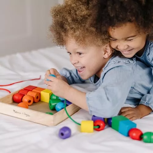 Enhance toddler learning with the Melissa & Doug Wooden Lacing Beads Set featuring vibrant beads for educational play and fine motor skill development.