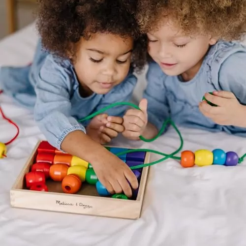 Explore the Melissa & Doug vibrant wooden lacing beads set, designed for toddlers to enhance fine motor skills and learning through play.