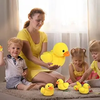 Plush yellow duck playset featuring baby ducks and a zipper pocket, ideal for children's educational play and imaginative fun.