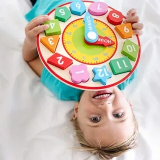 Wooden Shape Sorting Clock: Enhance early learning and teach time with this educational toy, designed to develop cognitive and motor skills.