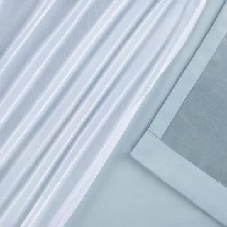 Elegant Luxe Talia Classroom Curtains feature double-layer sheer and blackout grommet style drapes, enhancing classroom functionality and style.